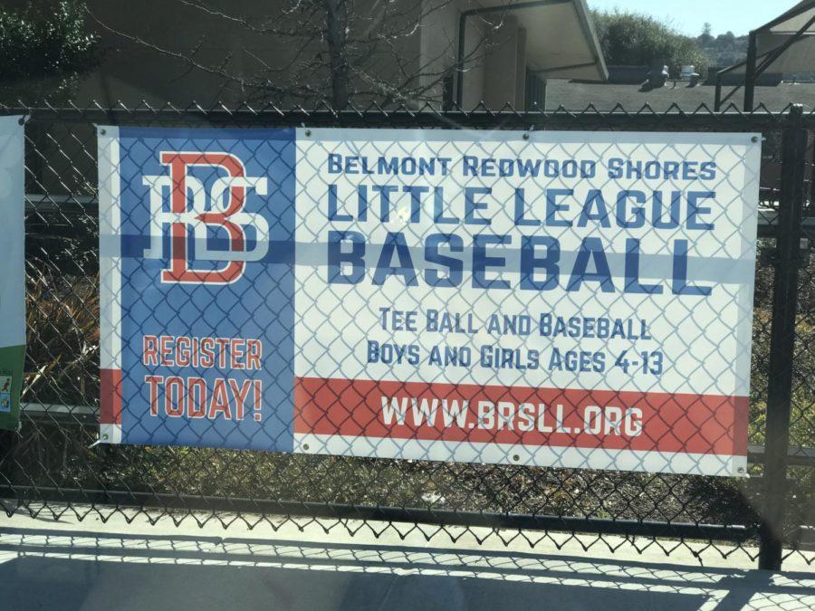 Banner posted in front of baseball field promoting BRSLL baseball.