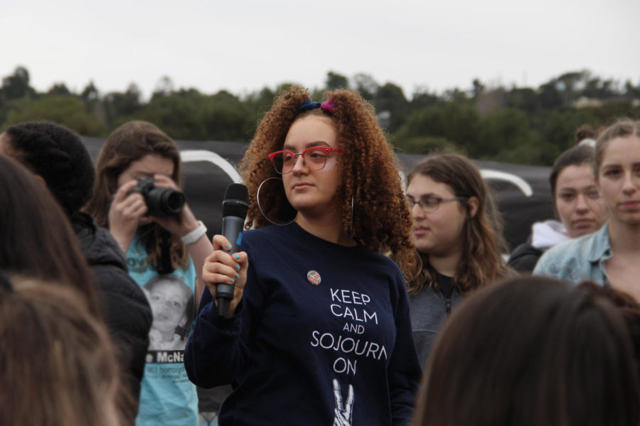 Hundreds of students made their way down to the quad for 17 minutes on March 14 at 10 a.m. to stand in solidarity with Parkland, Fla. Rosie Asmar, a senior, helps to lead the rally by singing songs and holding a moment of silence to honor the 17 students who were killed.