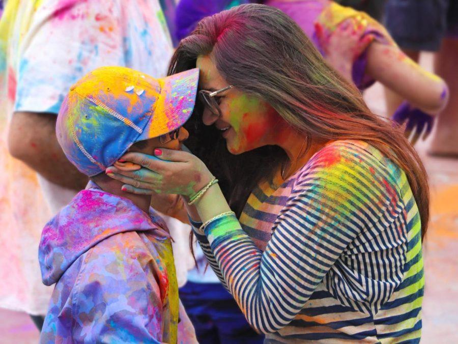 A mother and child share a moment as they celebrate Holi in Foster City on March 10. As revelers throwed and smeared brightly colored powder onto each other, they commemorated the beginning of spring, the harvest, and the triumph of good versus evil.