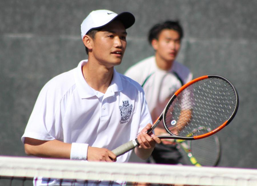 Carlmont+junior+Jerry+Liu+waits+to+receive+a+serve+with+his+partner%2C+senior+captain+Kevin+Xiang.+