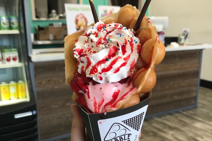 The Berries and Cream wrap is served in a waffle stuffed with strawberry ice cream and topped with whipped cream, sprinkles, fresh strawberries, and a strawberry glaze. 