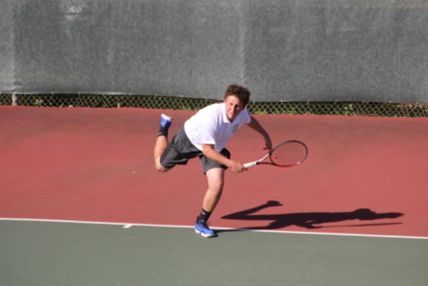 Sophomore Ben Barde serves the ball in his match against Woodside.