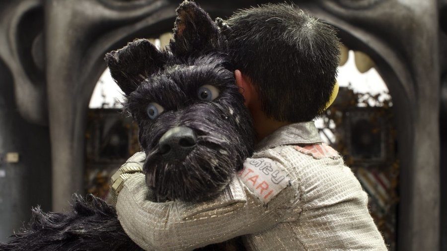 Child, Atari, and dog, Chief, embrace. The film Isle of Dogs features many emotional moments, like this one, that add depth to the story.