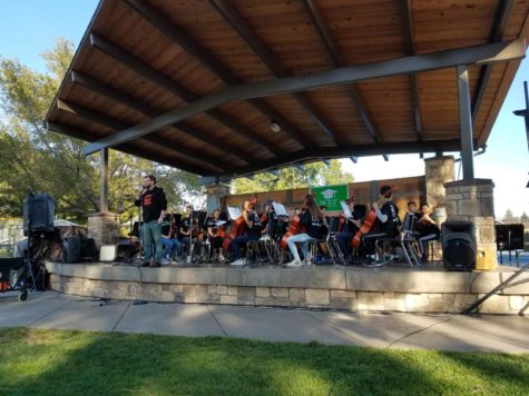 Colyn Fischer introduces the Central Middle School Orchestra during the Hometown Days kickoff event.