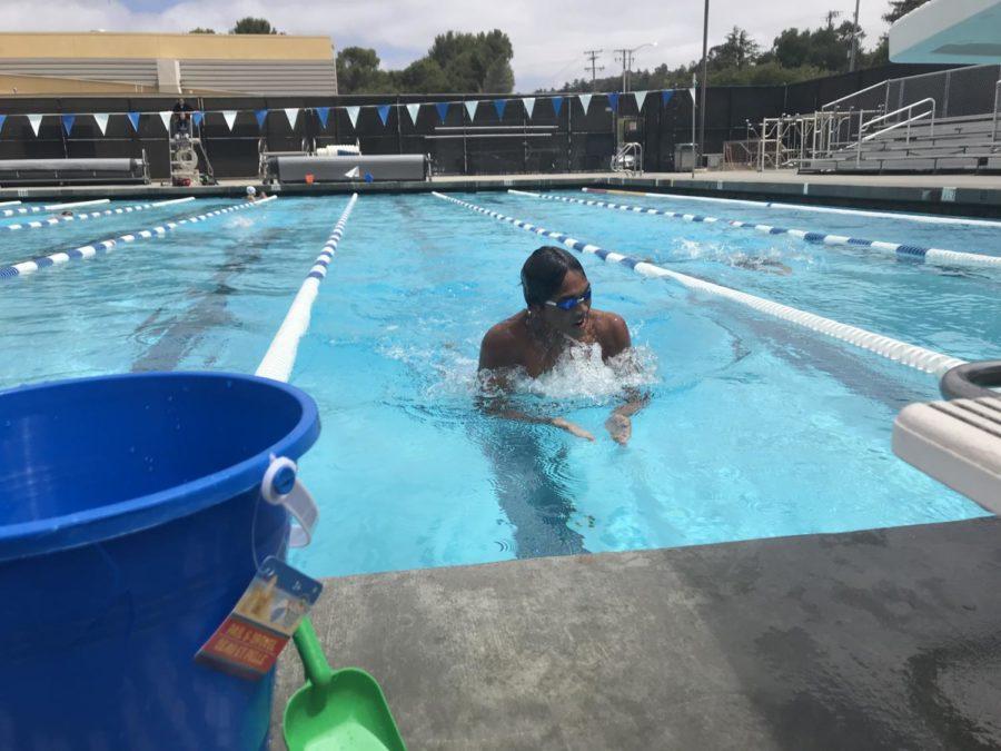 Josh Camerino, a senior, races his siblings amidst the Swim a Thon.