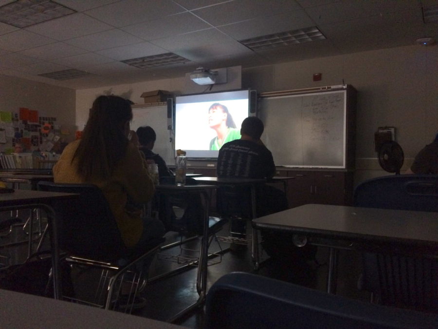 Members of Classic Films club watch a movie during lunch.