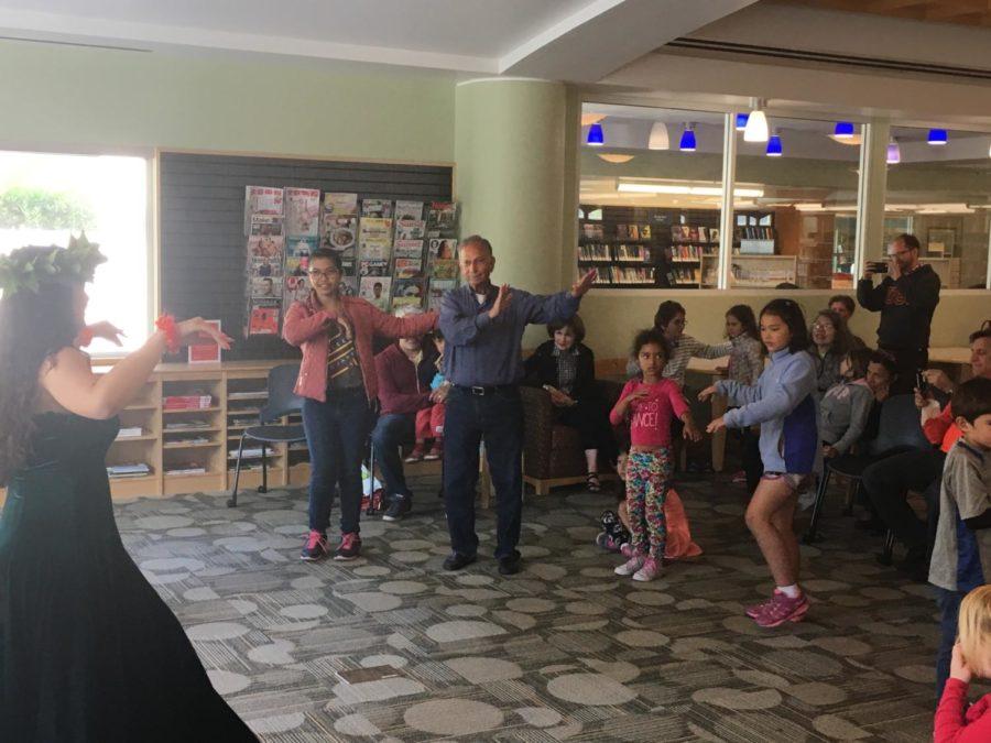 Library visitors learn basic hula steps as part of Asian-Pacific Heritage Month.