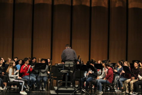 Symphonic Band rehearses in the Performing Arts Center before their performance.