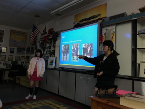 J-Pop club members present about school uniforms in one of their meetings.