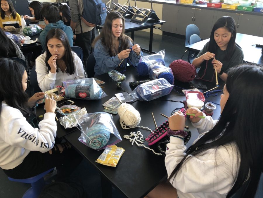 Emily Kim, a sophomore, and  some of her friends talk and knit during lunch.