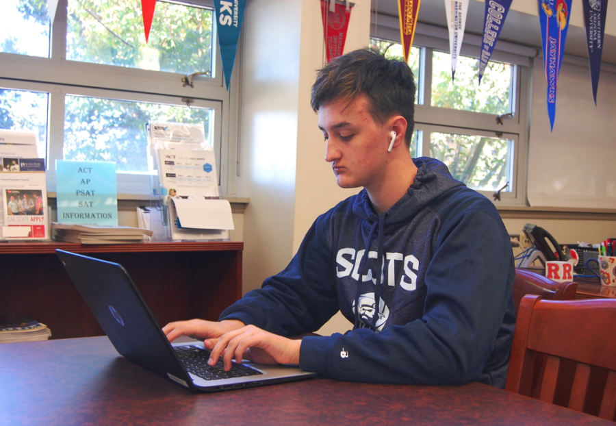 Senior Nick Mattas works on his laptop in the College and Career Center during lunch.