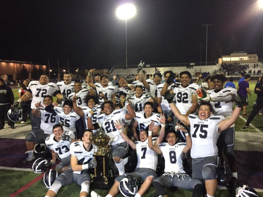 The varsity football game celebrates their history-making victory after years of losing to their rival, Sequoia.