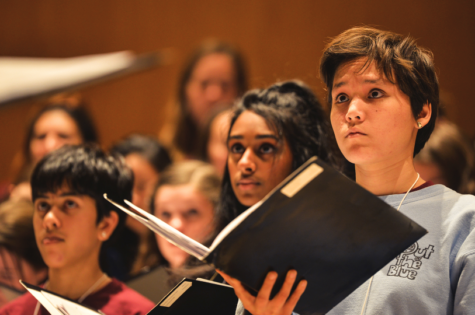 Amelia Espinosa, a senior, practices with the womens choir.
