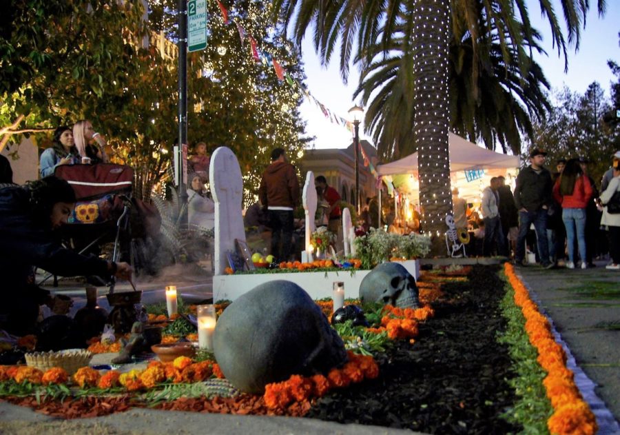 An ofrenda with burning incense and Aztec marigolds pays respect to the loved ones who have passed away.