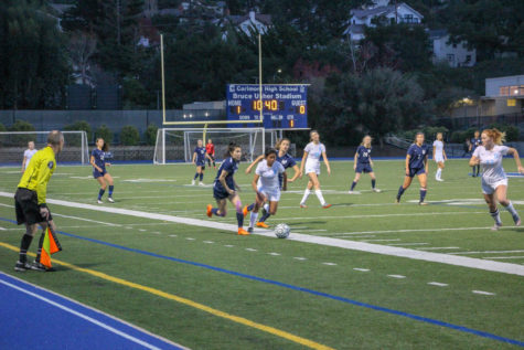 Kaylee Leong, a senior, takes a defender down the wing during the first half.
