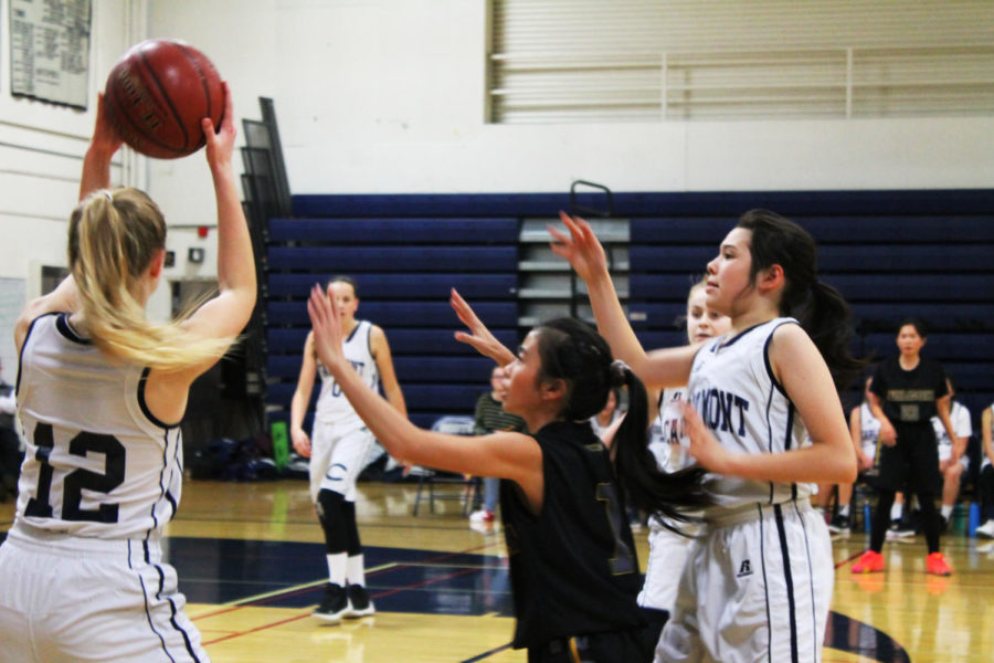 Nicole Olazar, a junior, looks to find an open teammate to pass the ball to. 