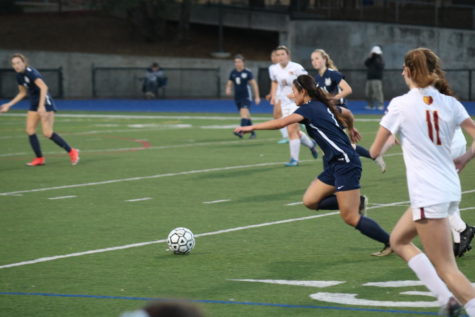 Ali Uozumi, a sophmore, charges towards the goal with the ball.