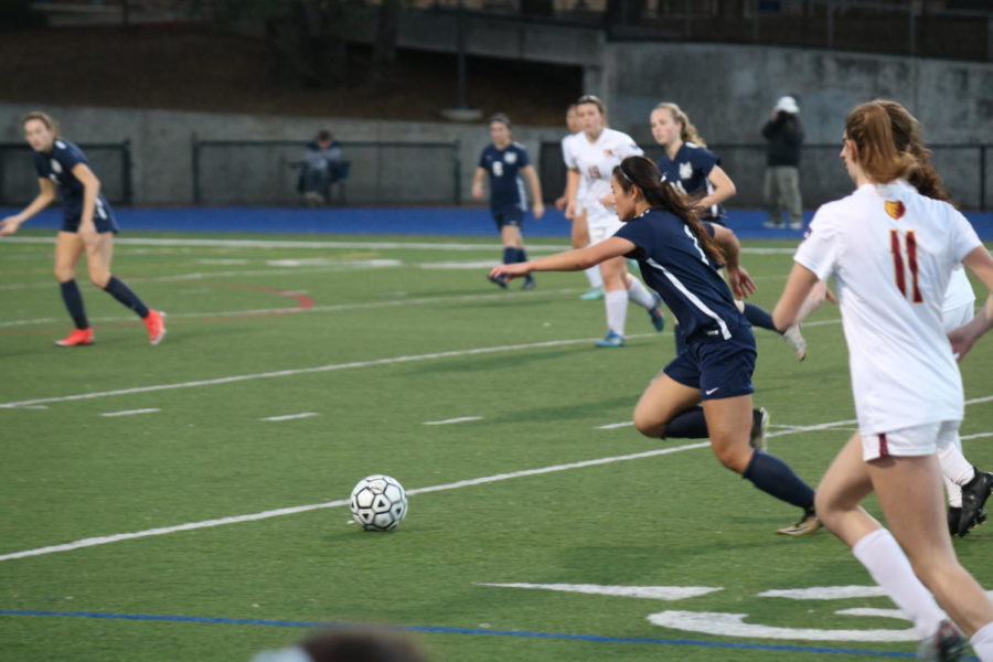 Ali Uozumi, a sophmore, charges towards the goal with the ball.