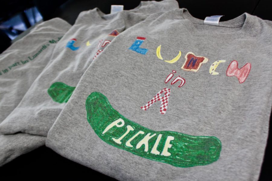 Specially designed t-shirts serve as uniforms for students who deliver sandwiches for Lunch in a Pickle Club.