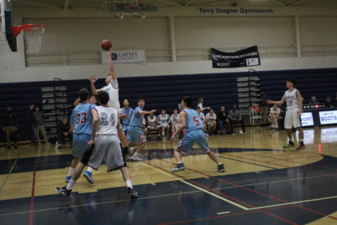 Will Hesselgren, a sophomore, attempts to score more points for Carlmont.