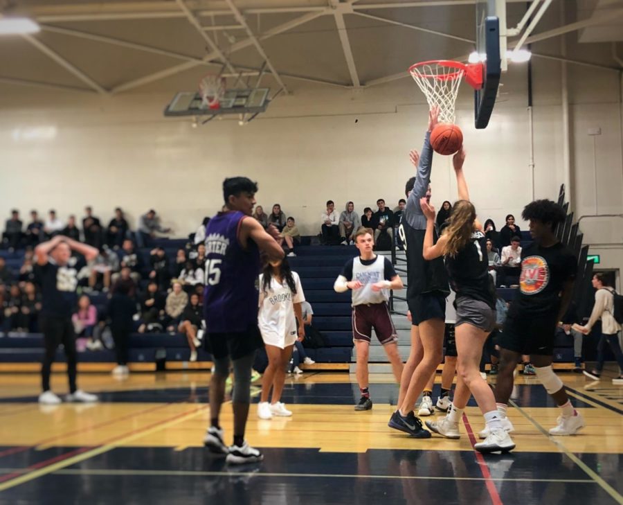 Junior Catherine Dahlberg attempts to shoot a basket for the junior team during one of the many games played in Mini Madness.