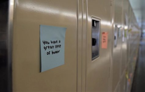 Sticky notes with kind messages are posted on every locker. 