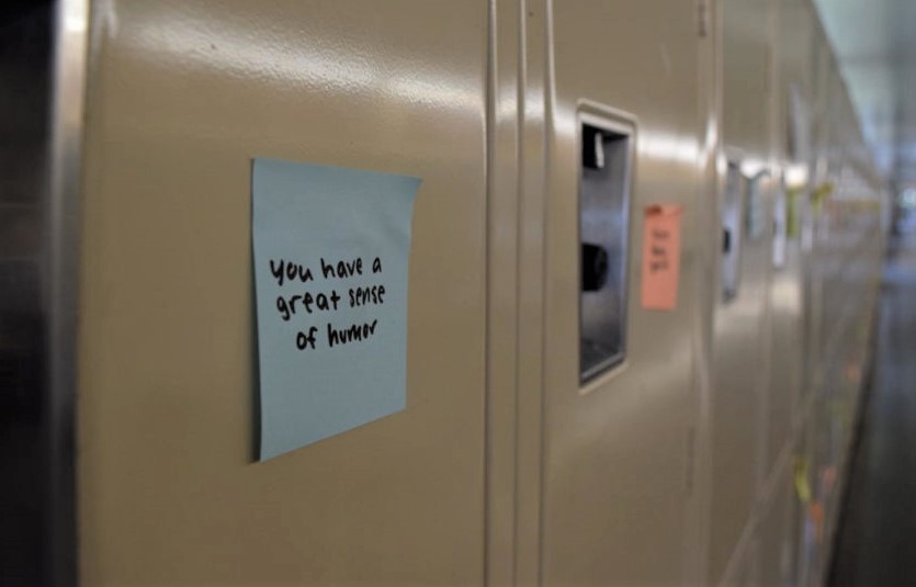 Sticky+notes+with+kind+messages+are+posted+on+every+locker.+