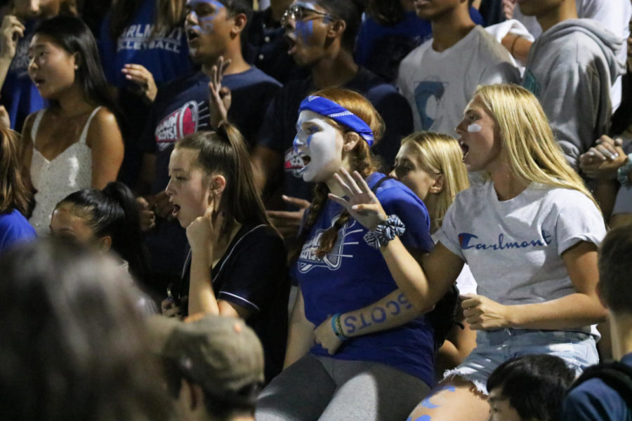 Hundreds+of+students+lined+up+along+the+bleachers%2C+cheering+for+the+Scots+in+blue+and+white+face+paint+and+glitter.+Friday+was+Carlmonts+first+home+game+of+the+season+and+with+a+final+score+of+69-19.+The+win+also+marked+the+second+consecutive+victory+for+the+Scots.+