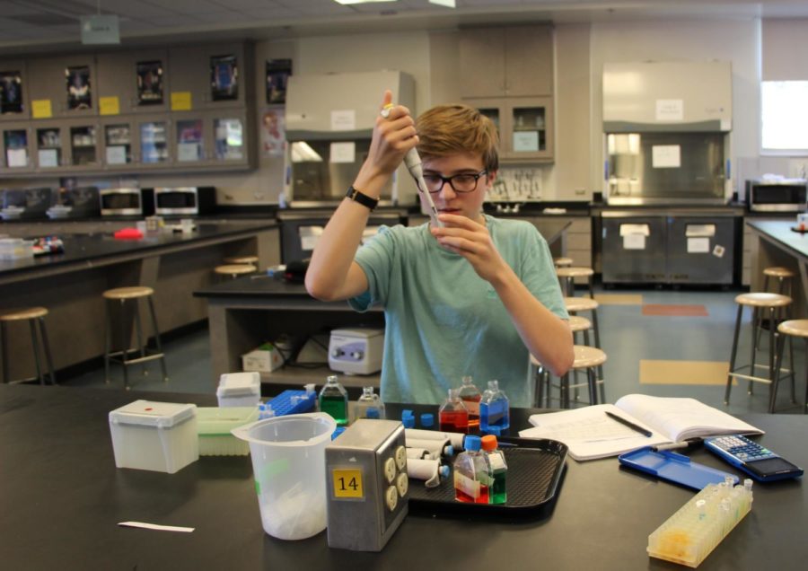 Sophomore Biotechnology I/II for BTI class works on one of their labs. In this lab we learned how to use pipettes properly so that we can measure really small amounts of liquid for the next lab work. said Lucas Eden, a sophomore. 