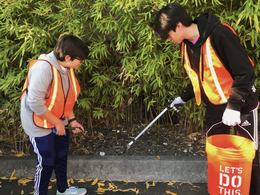 Sophomores Eliot Ozaki and Sergio Contreras work together to successfully clean up the bushes on Laurel Street.