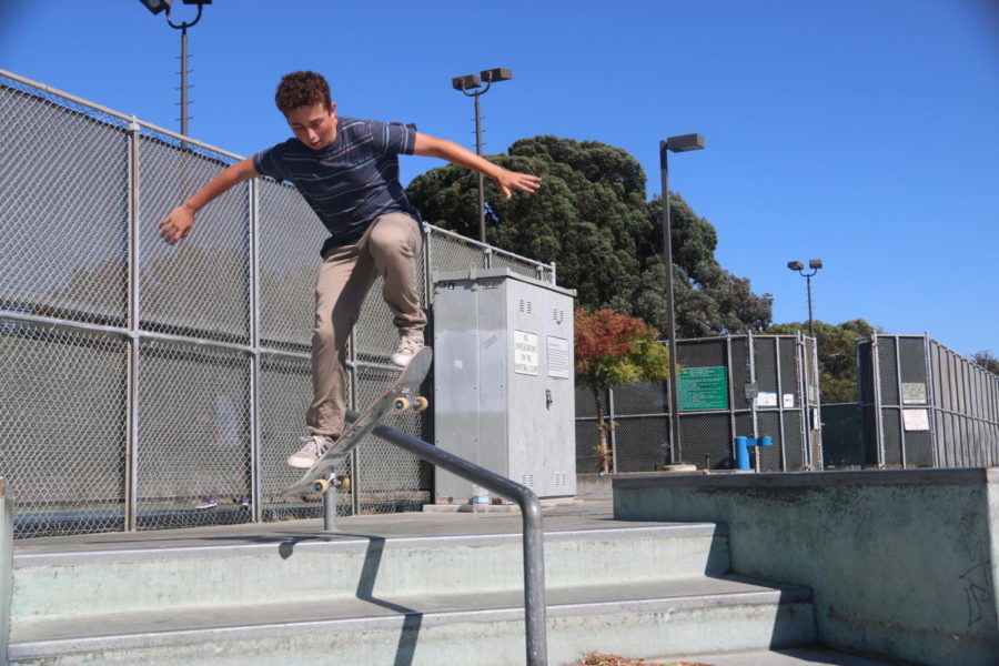 Freshman Joseph Matatyaou does a boardslide on a rail at the Foster City Skatepark. Matatyaou enjoys going to skateparks not only to skate, but also to meet new friends and be part of a community. 