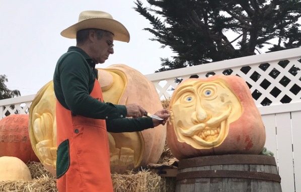 Mike Valladeo carves a pumpkin at the annual Half Moon Bay Pumpkin Festival.