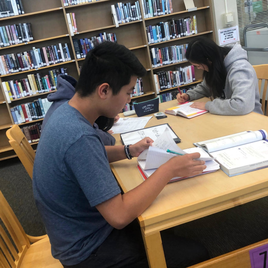 Students work on homework during lunch. Prospective freshmen have a chance to experience this life for half a day when they shadow at Carlmont.