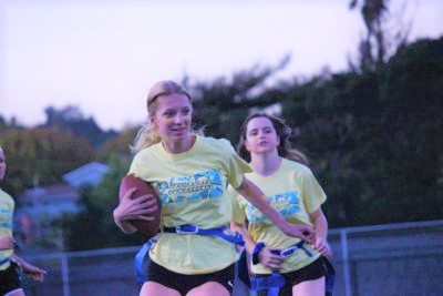 Lise Teyssier, a sophomore, runs with the ball as her teammate Carolyn Schnitz follows.