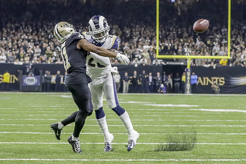 Rams cornerback Nickell Robey-Coleman knocks the ball out of Saints wide receiver Tommylee Lewis’ hands.