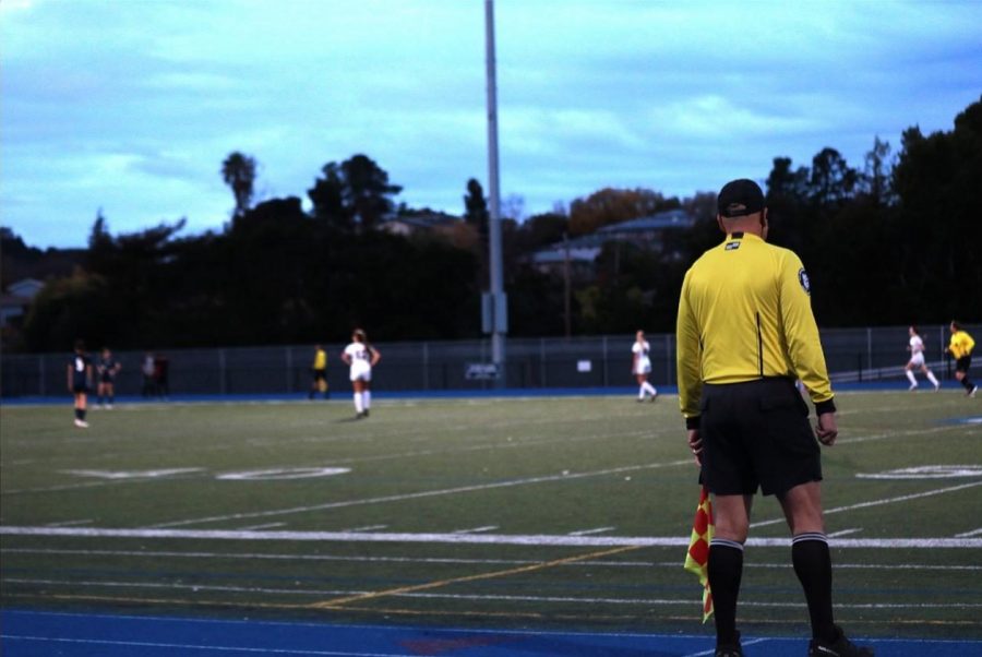 During a high school soccer game, players play without a video assistant referee (VAR).