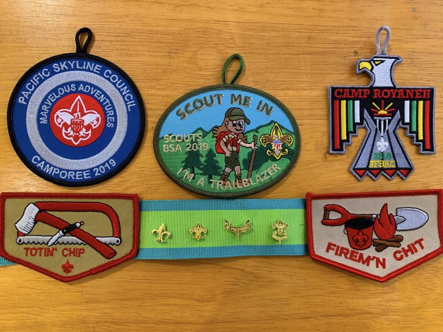 Temporary patches and pins signify key points in a Scouts journey, whether they are rank advancements or events.