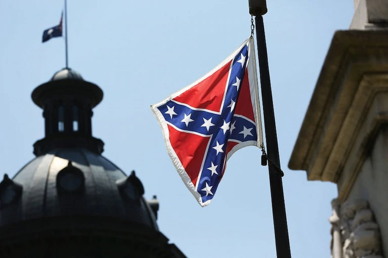 The Confederate flag billows over the South Carolina Statehouse, it was not removed until June 2015 by a state bill. 
