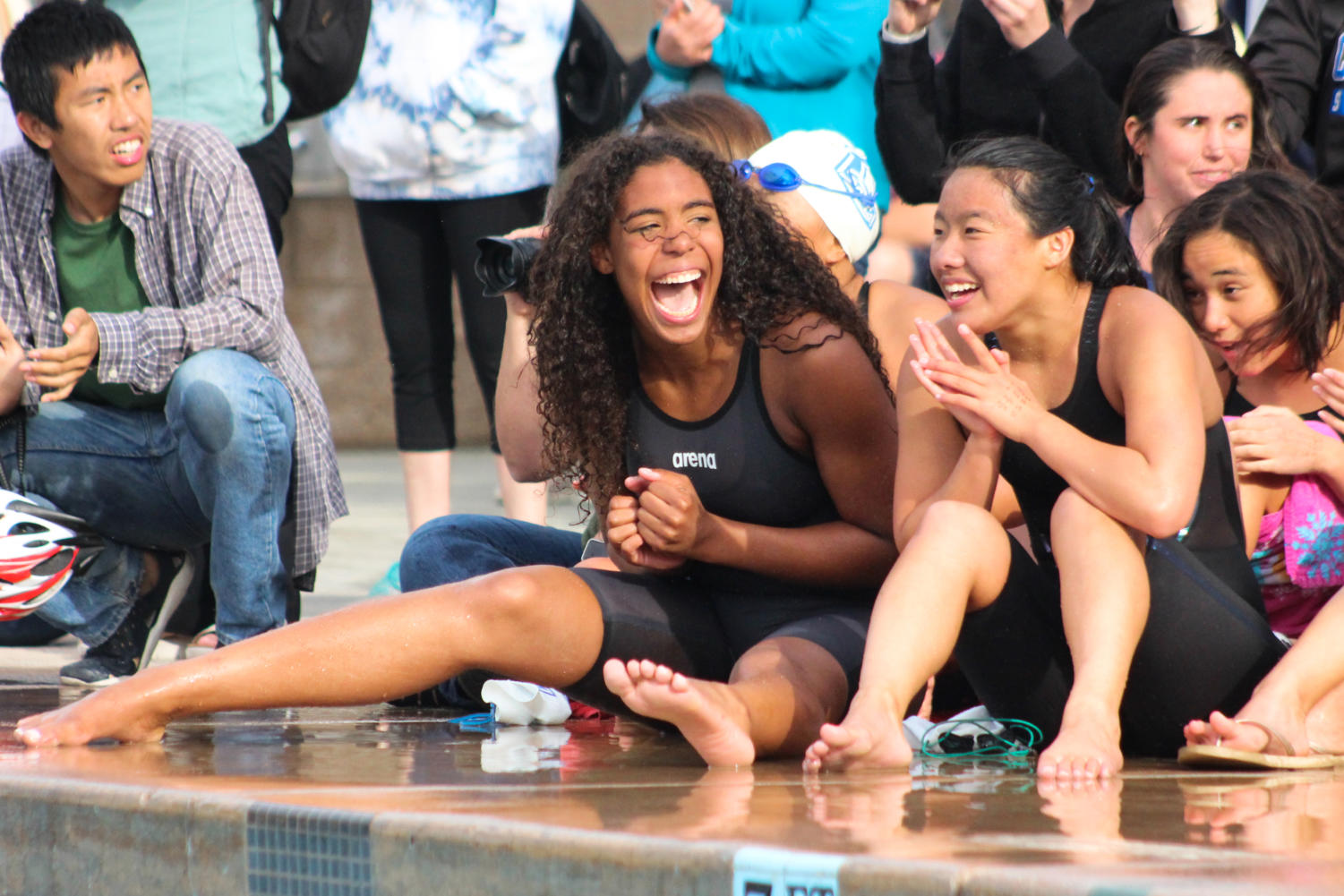 Varsity Swimmer Morgan Hawes (left) screams with joy after realizing Carlmont swept all PALs championship titles for a second year in a row.
