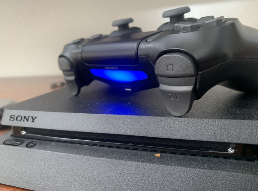 The+PS4+controller+lights+up%2C+indicating+a+player+is+ready+to+begin+gaming.+
