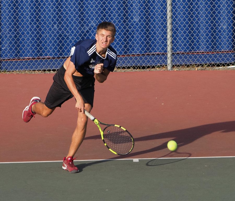 Daniel+Generalov%2C+a+sophomore+on+the+boys+tennis+team%2C+plays+in+a+singles+match+against+Hillsdale+during+the+short-lived+2020+season.