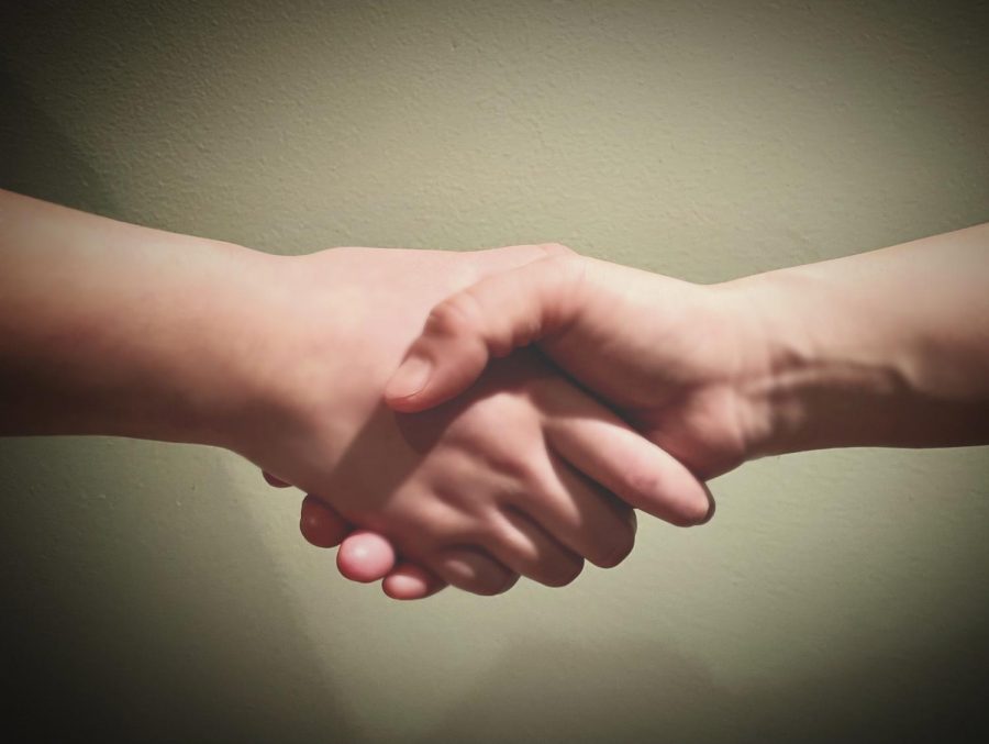 A handshake is often recognized as a symbol of forgiveness.
