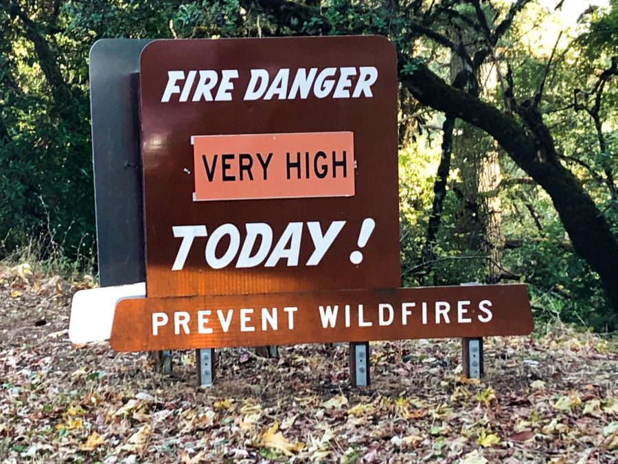 A sign warns of possible wildfire.