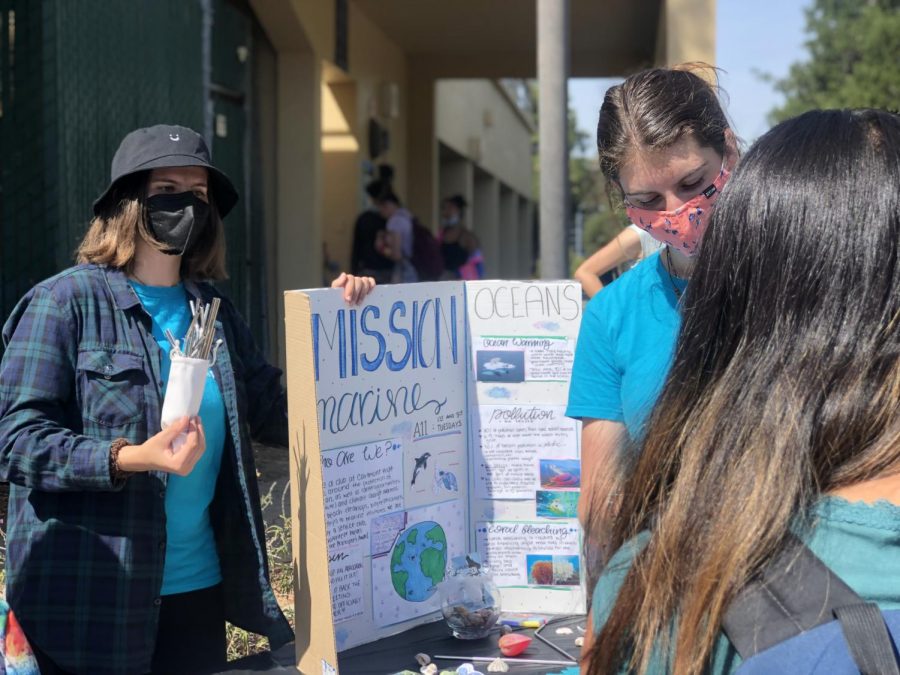 Members of Carlmont’s MissionMarine Club demonstrate how the club spreads awareness on environmental issues at their Clubs Fair booth.