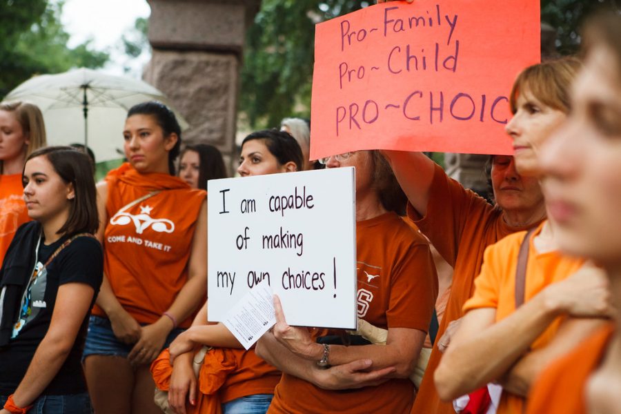 Protestors in Texas rally together to stand against the passage of the anti-abortion and voting restriction laws HB2 and SB1. 