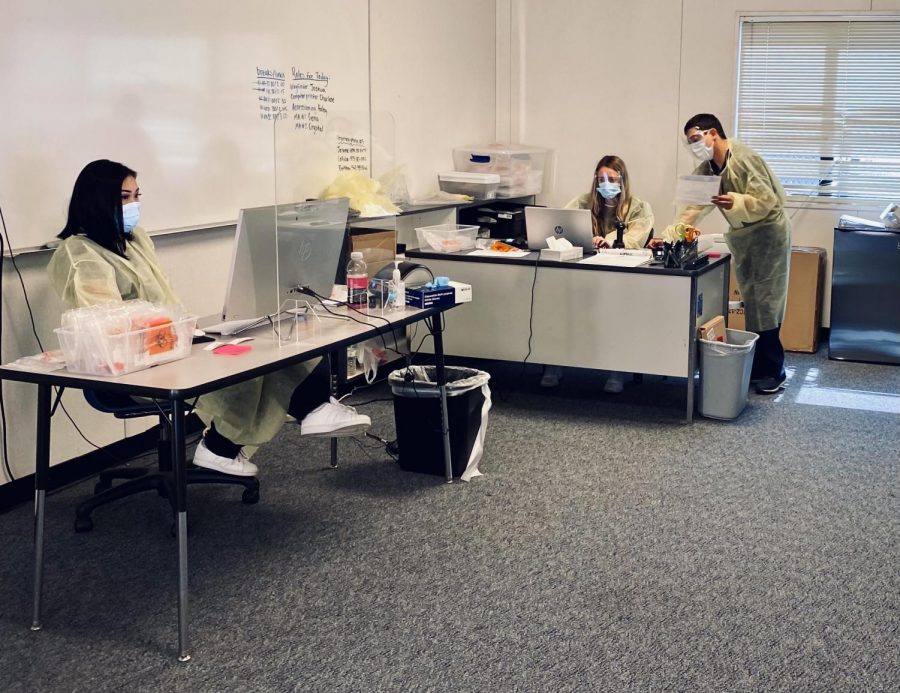 Health personnel operate Carlmonts on-campus COVID-19 testing area. 