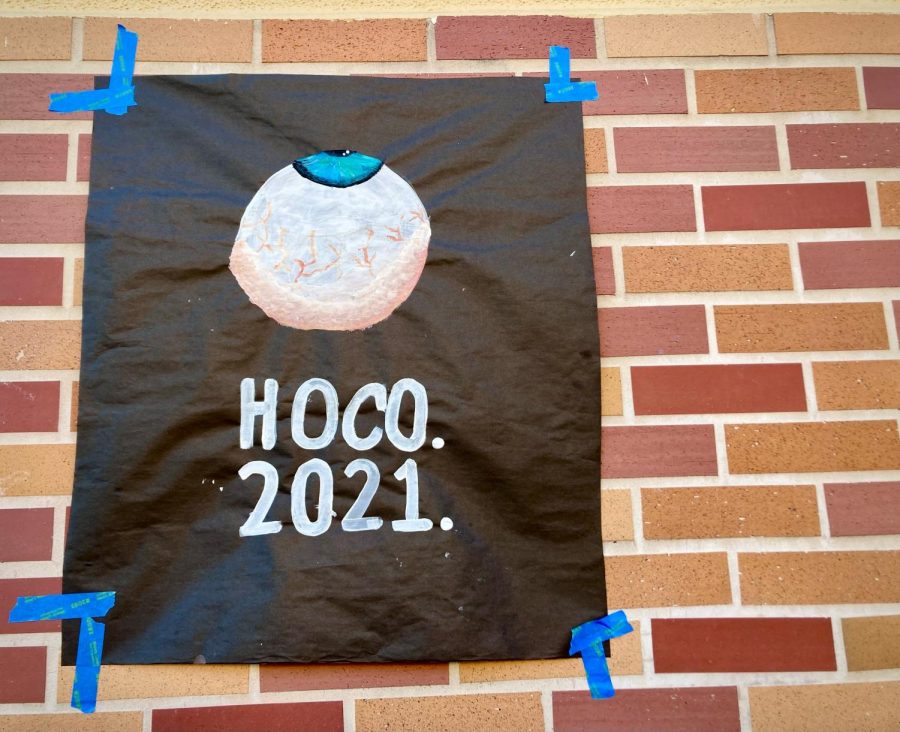 A poster in the quad advertising the 2021 homecoming dance to the student body. 