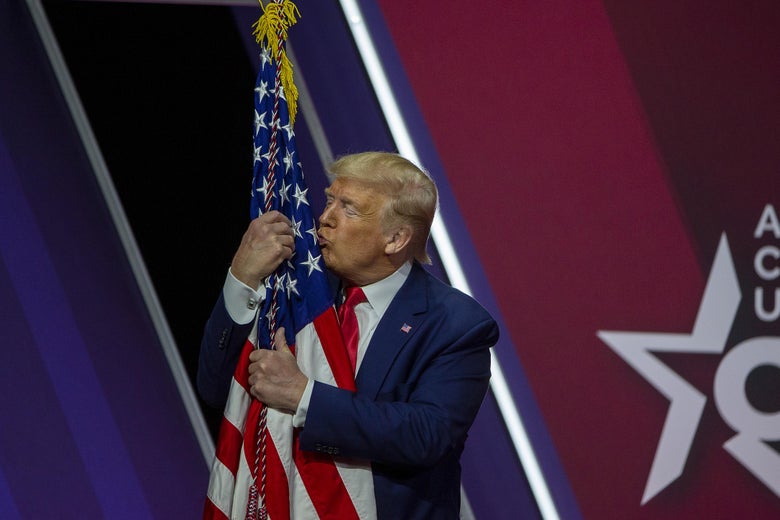 Donald Trump embraces the American Flag at the the annual Conservative Political Action Conference (CPAC). 