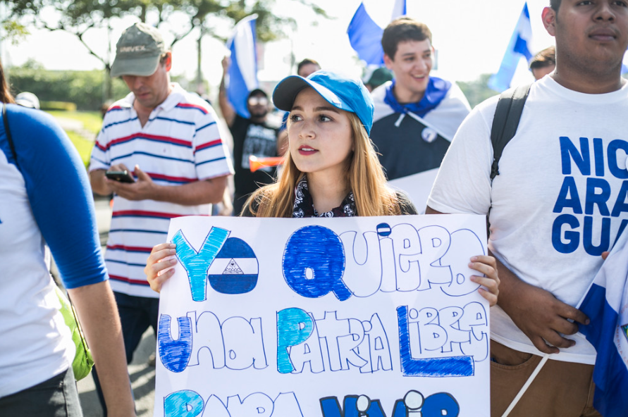 A protester marches in Managua, echoing calls for a free homeland.