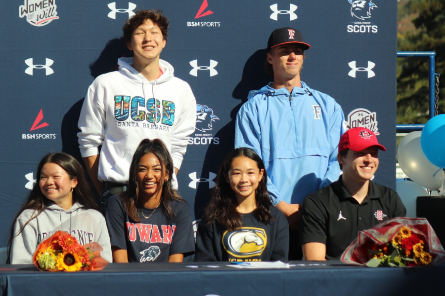 Carlmonts signed student-athletes pose together.
